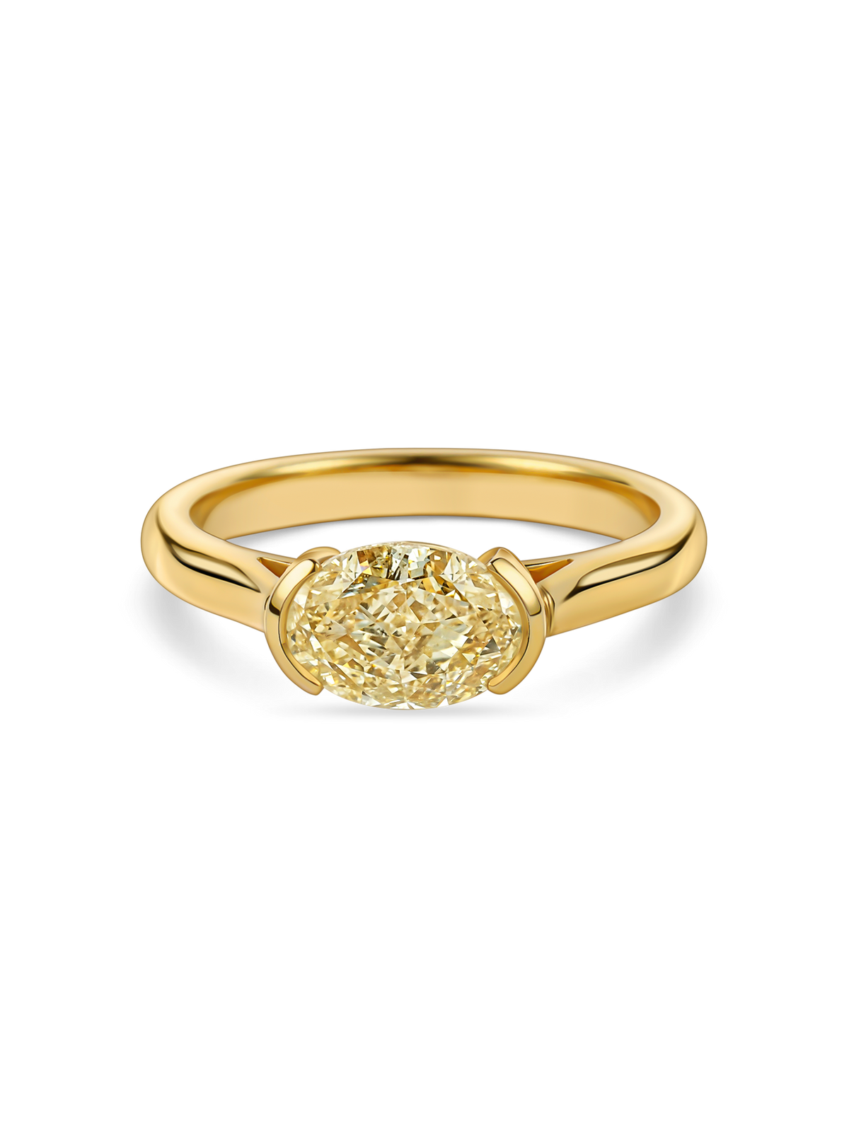 Yellow lab grown oval diamond in an east-west yellow gold engagement ring by Faire & Fine