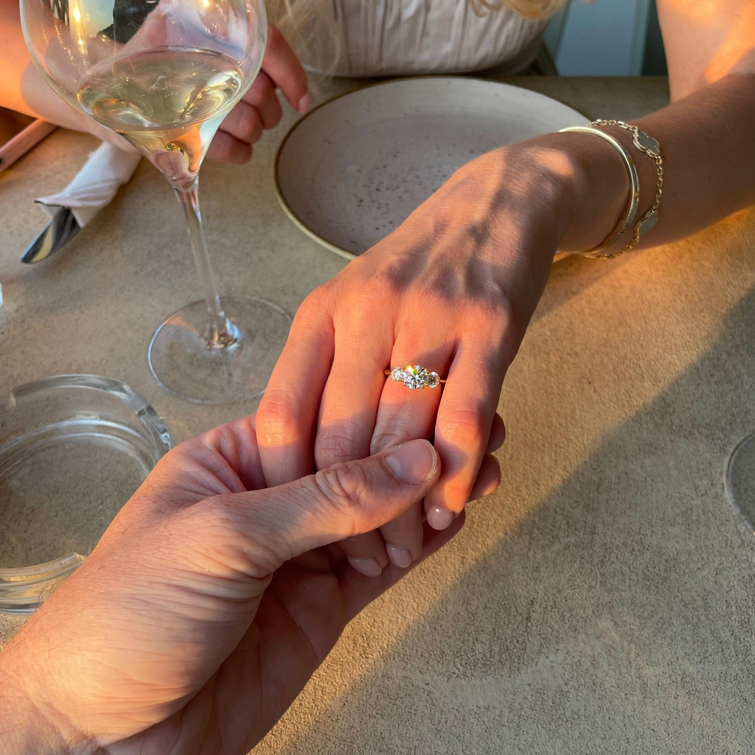 Round Trilogy Engagement Ring. Customer Photo