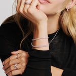 Woman wearing two lab grown tennis bracelets