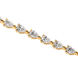7ct lab grown pear diamond tennis bracelet in 18k gold without background