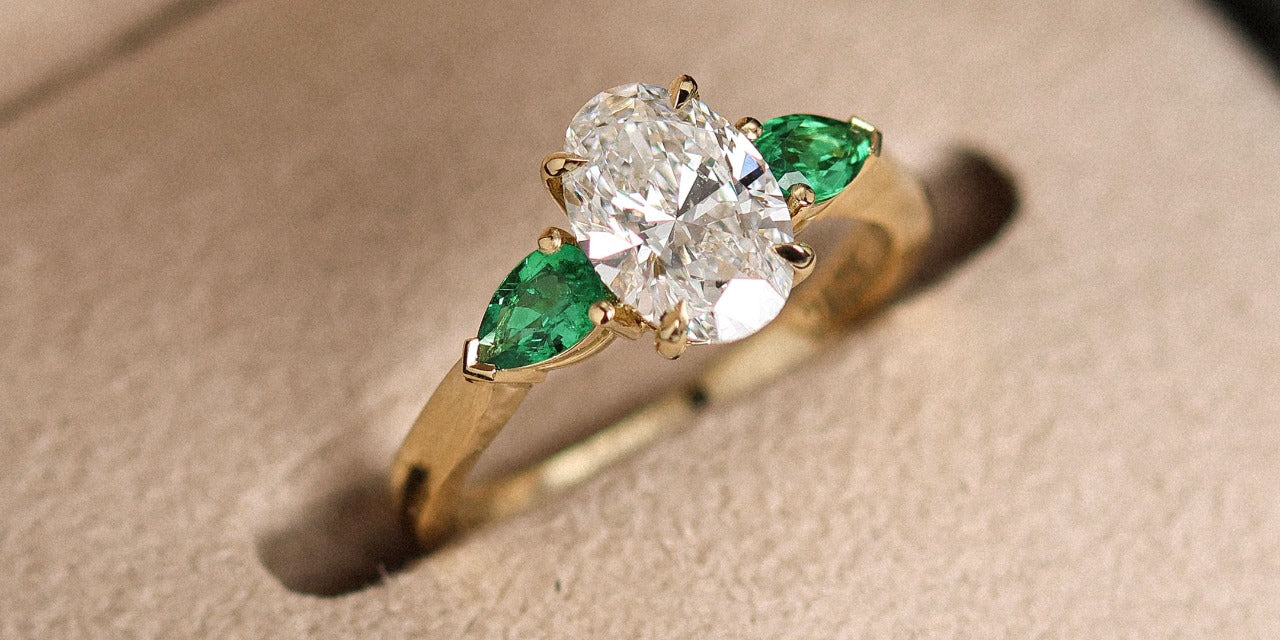 Oval & Emerald Custom Engagement Ring made in London by family jewellers