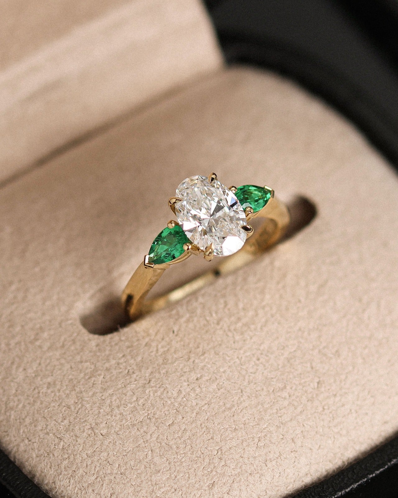 Oval & Emerald Custom Engagement Ring made in London by family jewellers