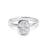 front view of platinum bezel set elongated cushion cut engagement ring. Handmade in london with recycled precious metals and lab grown diamonds. 