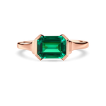 Front view of lab-grown emerald ring in east west setting with 18K rose gold band