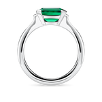 Side view of lab created emerald ring with east west setting and platinum band