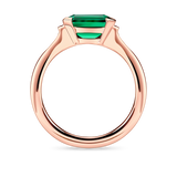 Side view of lab created emerald ring with east west setting and rose gold band