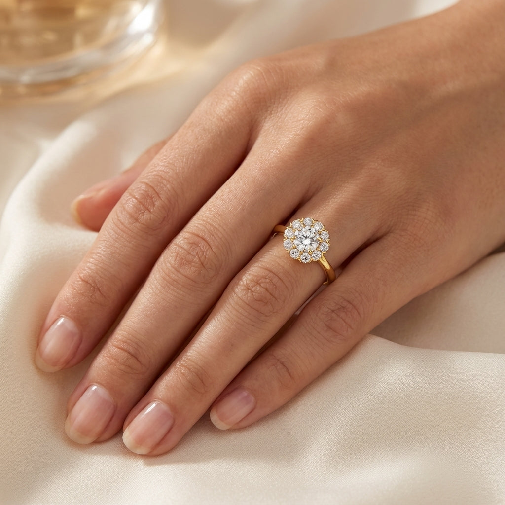 Model wearing our yellow gold vintage inspired daisy engagement ring. Made with lab grown diamonds in London UK by independent jewellers. 