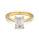 front view of yellow gold lab grown emerald cut solitaire engagement ring with cathedral setting. 2 carat