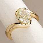 Custom lab grown diamond engagement ring in yellow gold, featuring a yellow oval. Handmade in Hatton Garden, London, UK