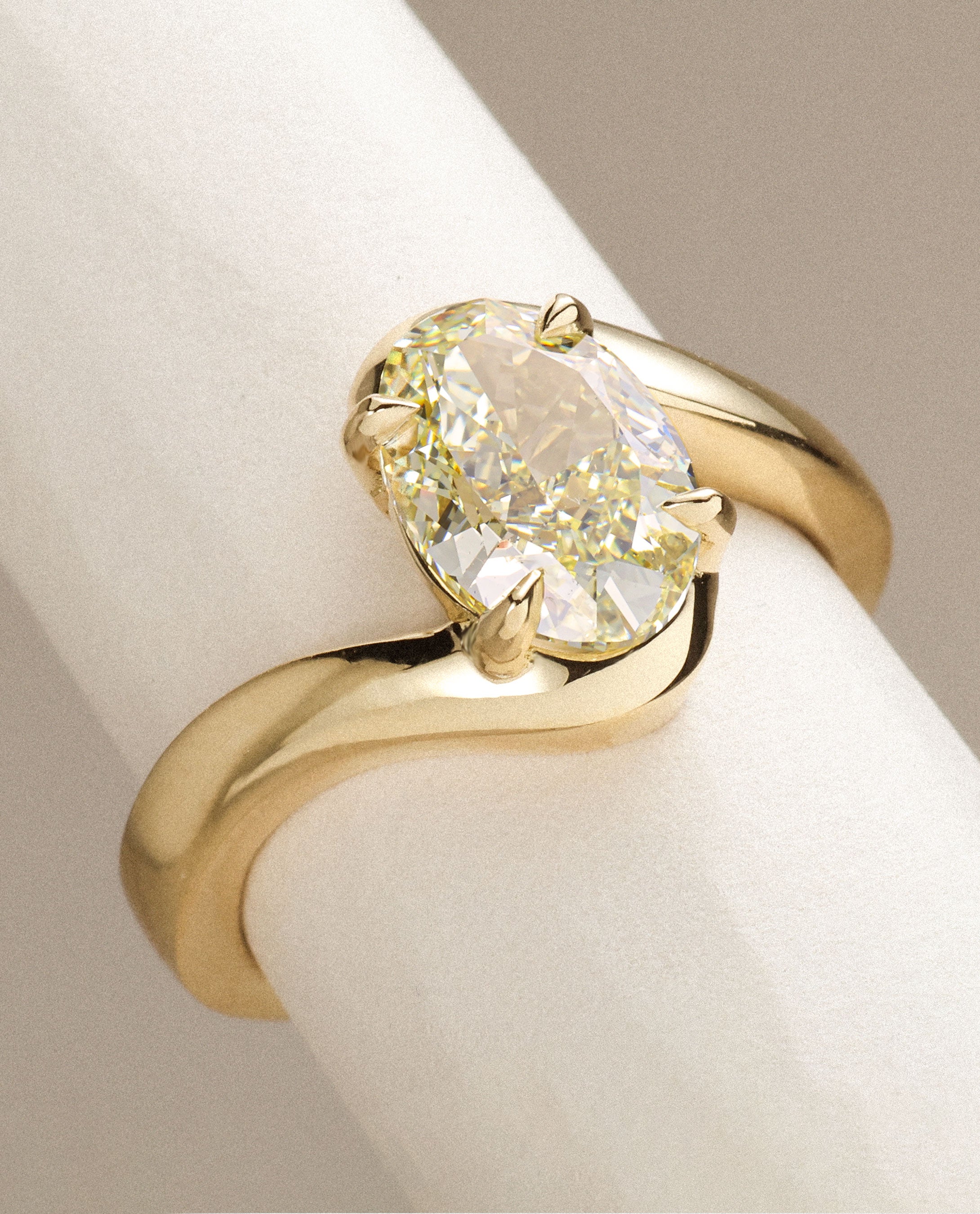 Custom lab grown diamond engagement ring in yellow gold, featuring a yellow oval. Handmade in Hatton Garden, London, UK