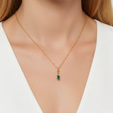 Bezel set lab grown emerald necklace. Lab grown gem with 9k yellow gold necklace. hand finished in hatton garden london