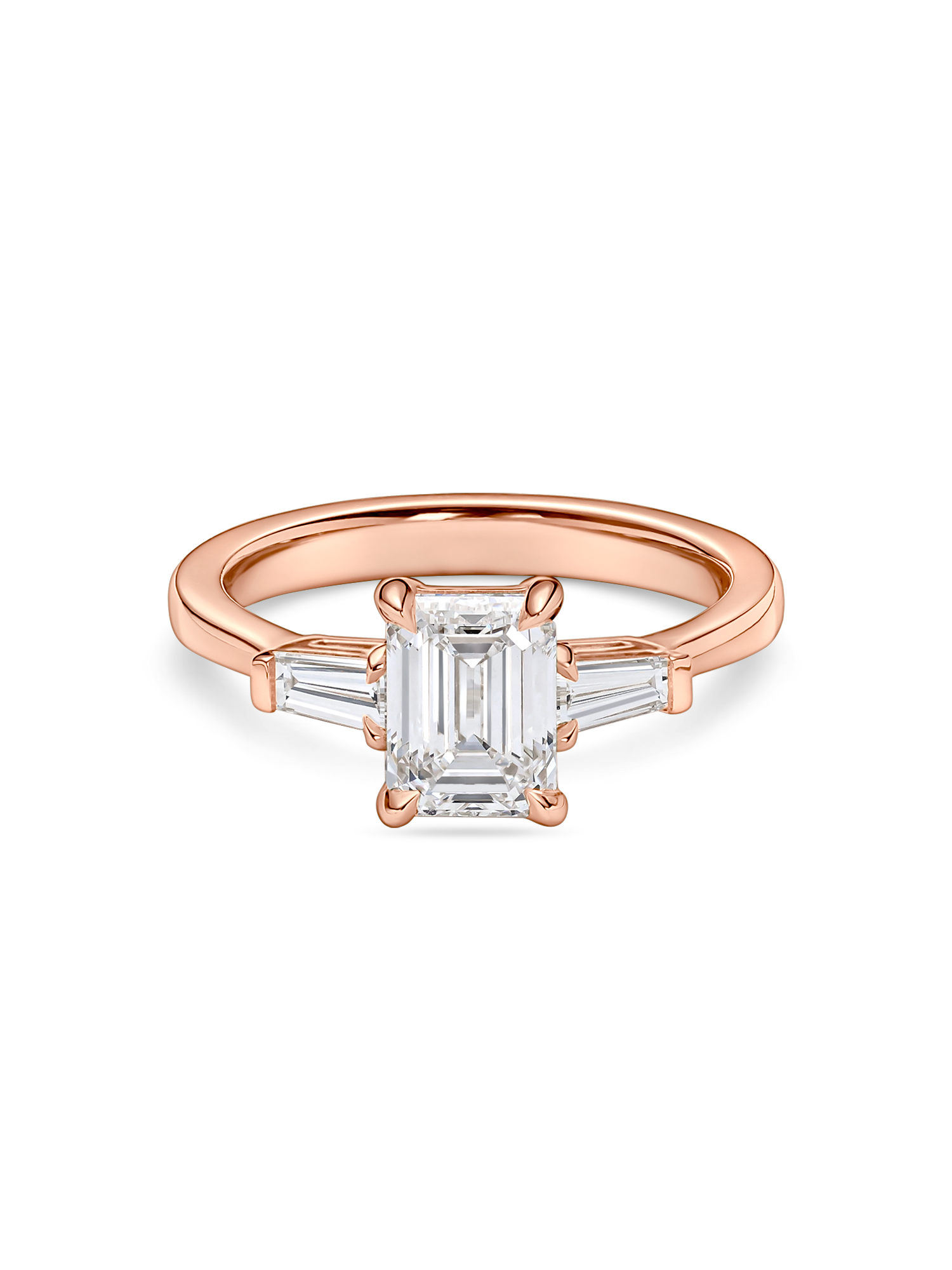 front view of emerald cut trilogy engagement ring in rose gold. features lab grown diamond
