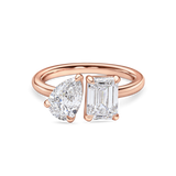 front view of a 2 carat toi et moi ring. Lab Grown pear and emerald cut diamonds in rose gold