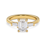 emerald cut trilogy engagement ring in yellow gold side view. features 2 carat lab grown diamond