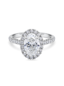 Beautiful lab grown oval halo engagement ring with diamond set band. Platinum band, front view