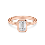 front view of a 1.5 carat bezel set emerald cut solitaire in rubover setting rose gold