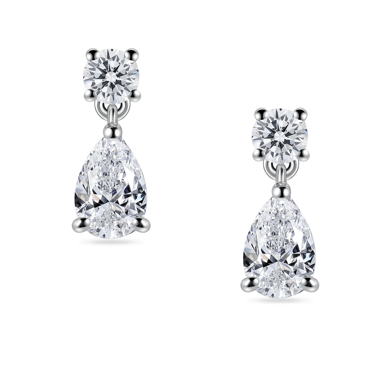 close up of lab grown diamond drop earrings. Round and pear diamond earrings in platinum, on model. 2 carats total weight