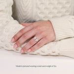 model wearing a 2 carat toi et moi ring. Lab Grown pear and emerald cut diamonds in platinum