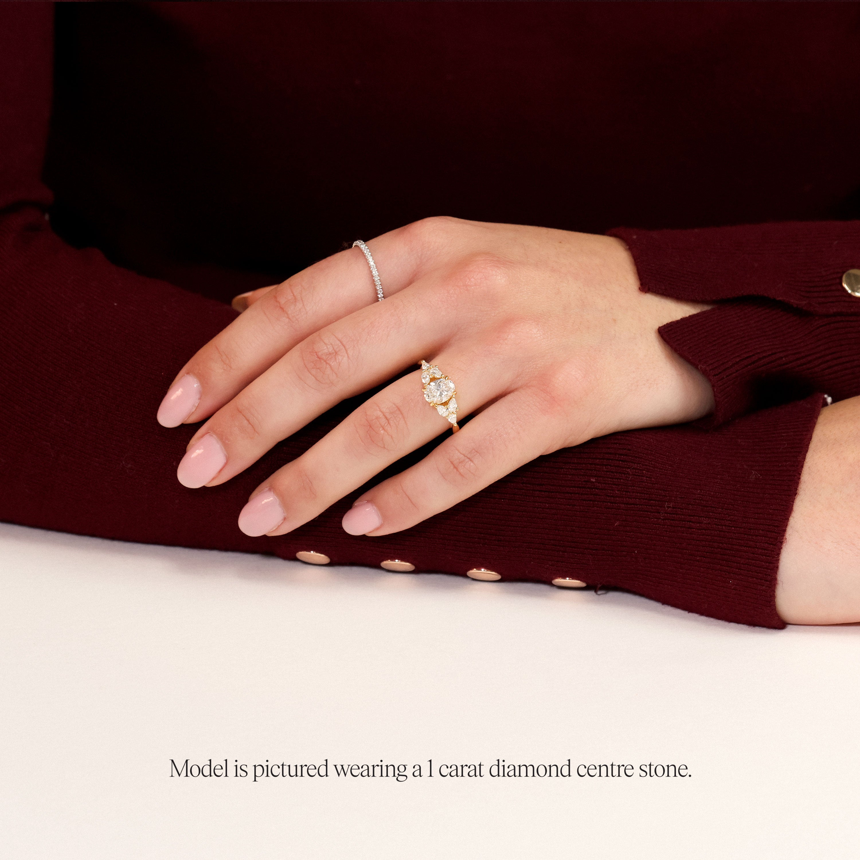 model wearing 1 carat Floral oval engagement ring with lab grown diamond and pear side stones in rose gold