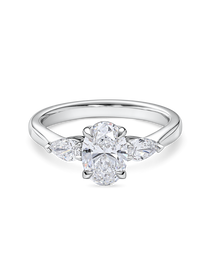 Front view of platinum oval engagement ring. Lab grown trilogy with side pears