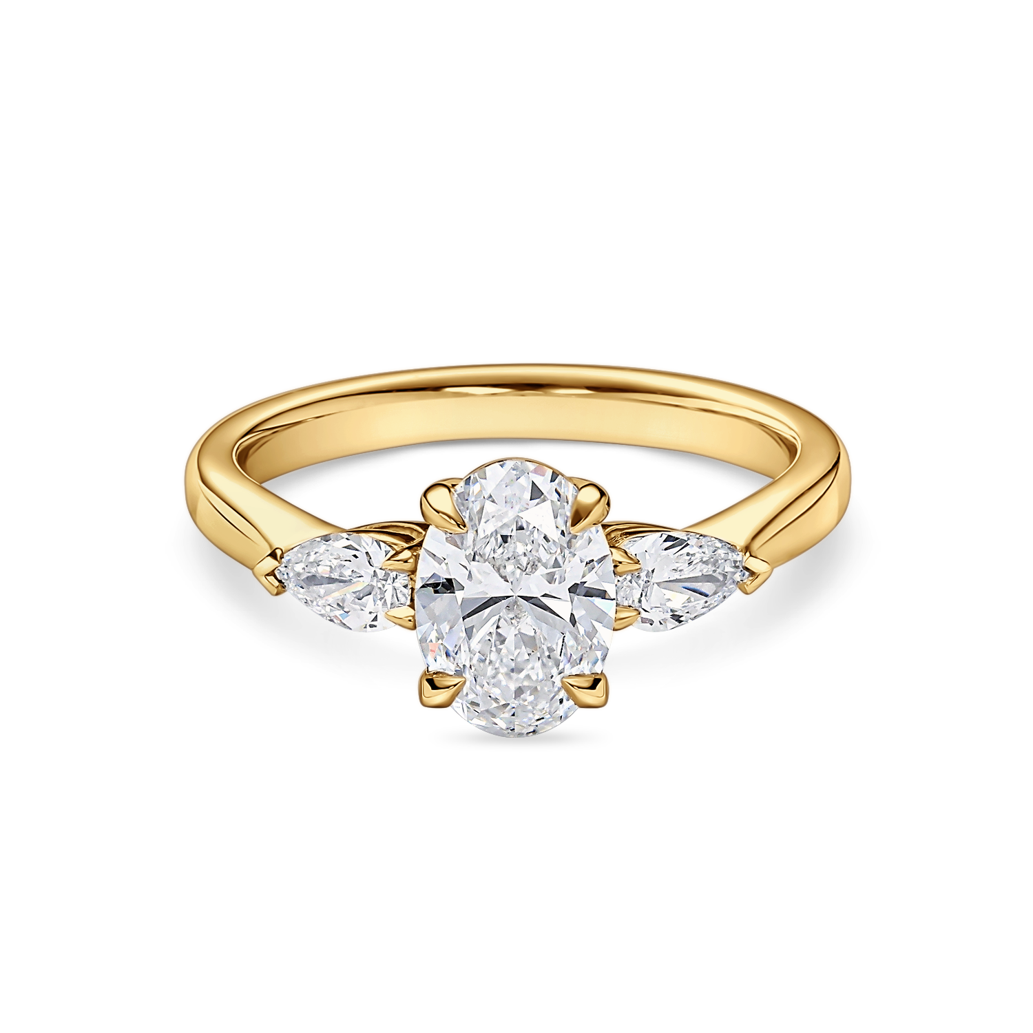 Front view of yellow gold oval engagement ring. Lab grown trilogy with side pears