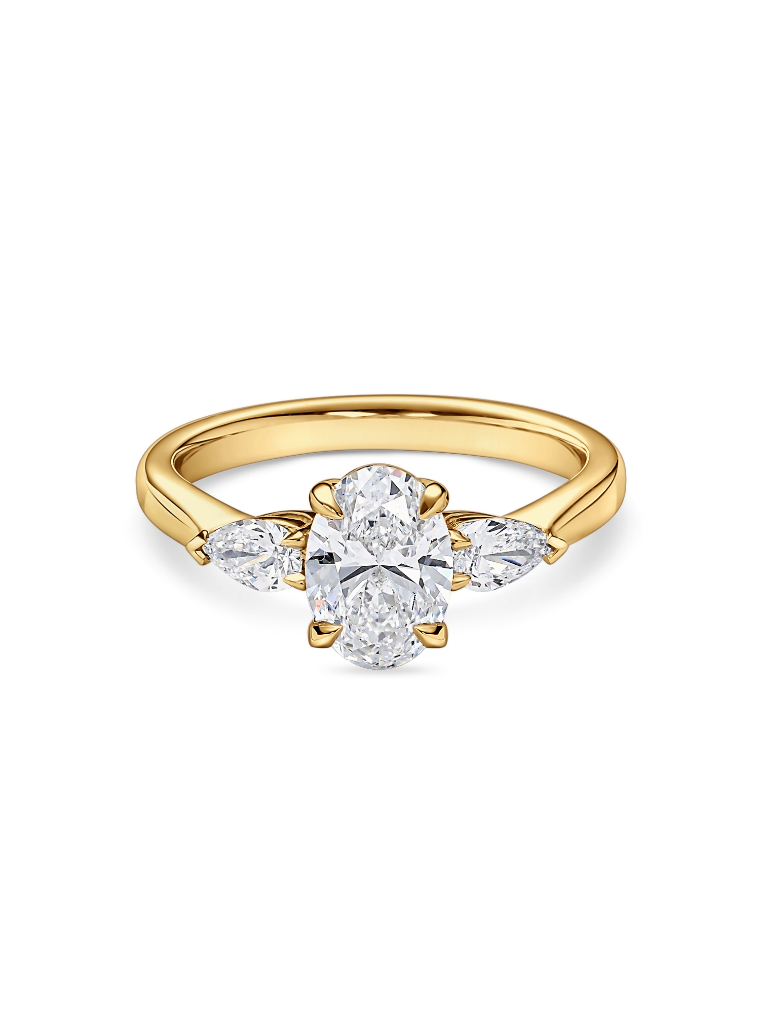 Front view of yellow gold oval engagement ring. Lab grown trilogy with side pears