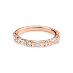 rose gold round and baguette wedding ring made out of lab grown diamonds and recycled precious metals.