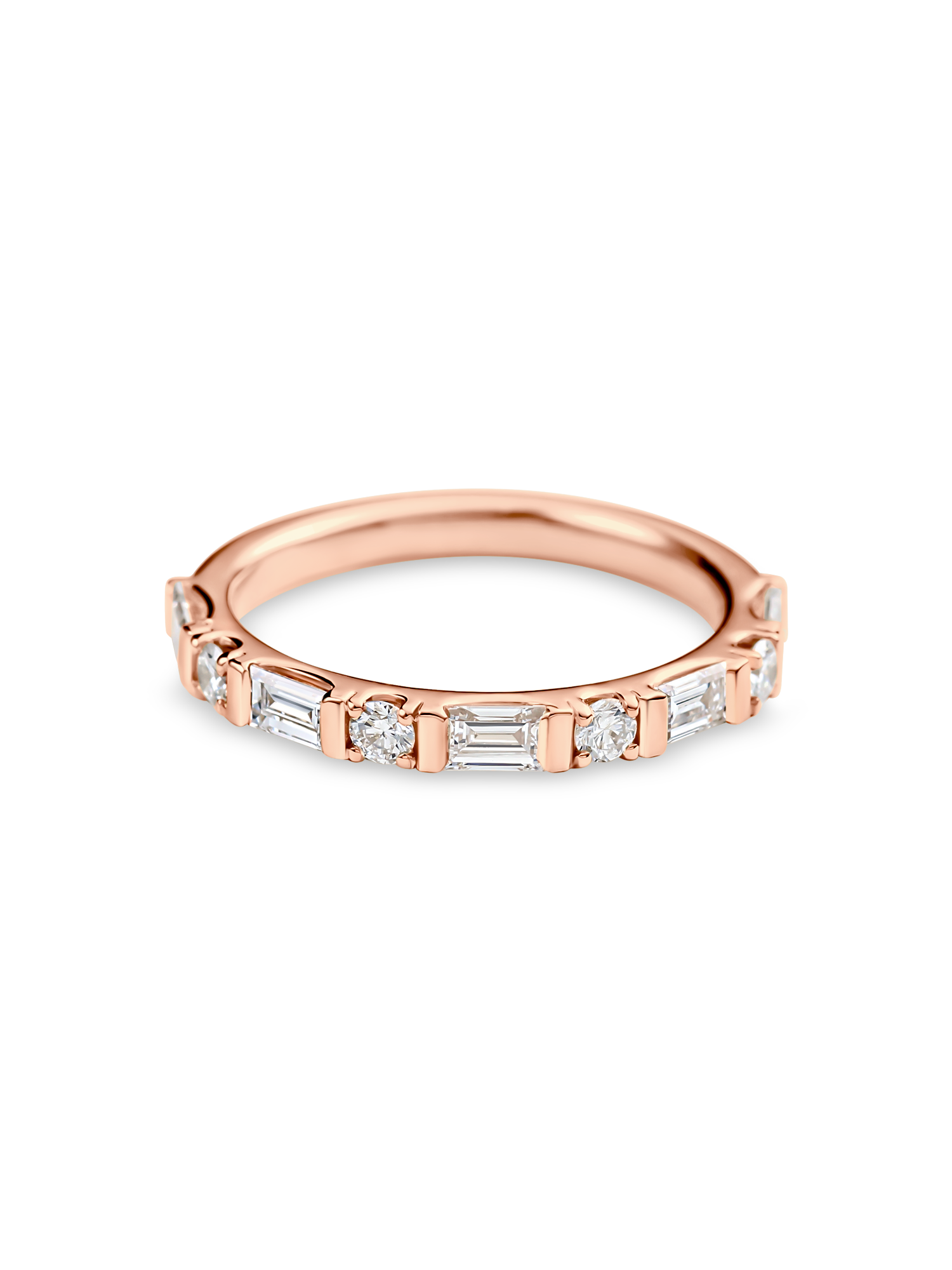 rose gold round and baguette wedding ring made out of lab grown diamonds and recycled precious metals.