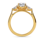 side view of Three stone engagement ring with cushion centre lab grown diamond and pear side stones in recycled yellow gold