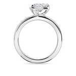 side view of the tilted pear solitaire engagement ring set in platinum featuring a lab grown diamond.