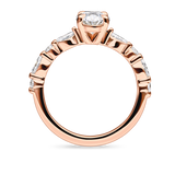 side view of unique rose gold engagement ring featuring lab grown diamonds and a diamond set band. Made in london, uk