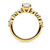 side view of unique yellow gold engagement ring featuring lab grown diamonds and a diamond set band. Made in london, uk