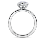 side view of 1.5carat bezel set pear shaped engagement ring in platinum featuring lab grown diamond.