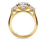 side on look at the round trilogy engagement ring featuring three lab grown round diamonds in yellow view