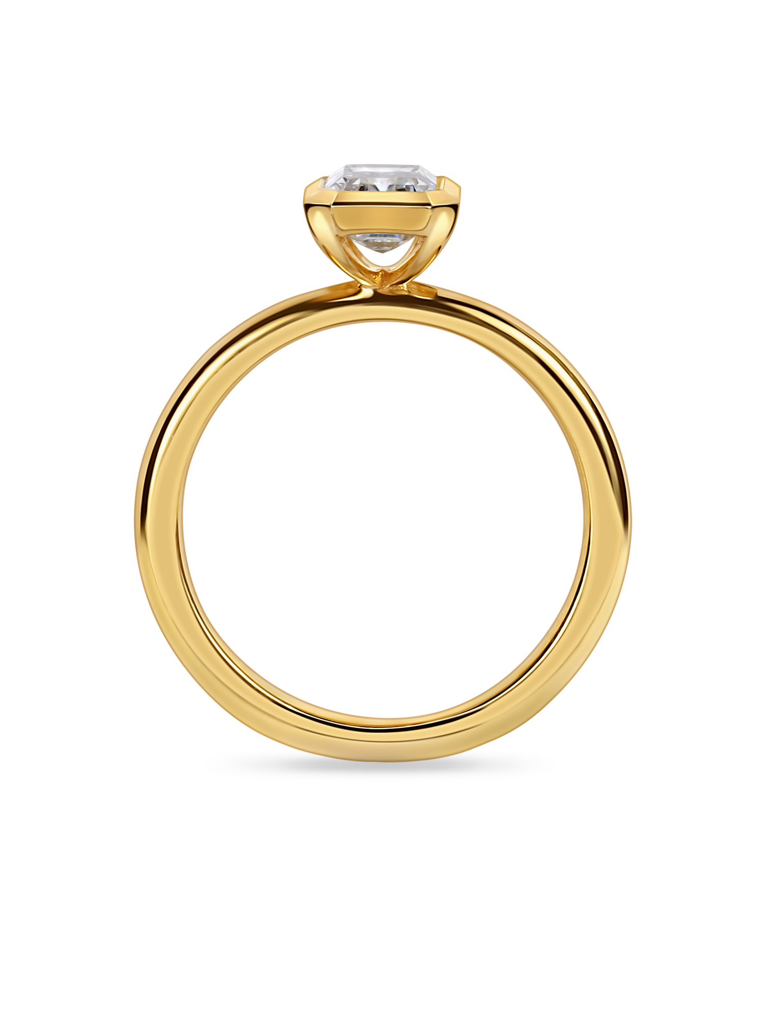 side view of a 1.5 carat bezel set emerald cut solitaire in rubover setting yellow gold