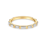 skinny baguette wedding band in yellow gold. made with lab grown diamonds and recycled precious metals