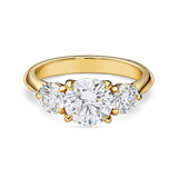 front view of round trilogy engagement ring featuring three lab grown round diamonds in yellow gold