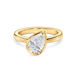 front view of the titled pear solitaire engagement ring in yellow gold, featuring a lab grown diamond. 